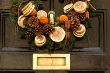 17 cinnamon, pinecones, dried citrus and evergreen wreath