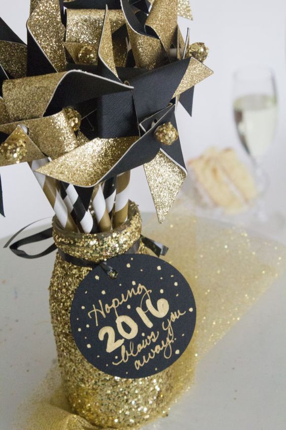 glitter mason jar and gold and black paper fans