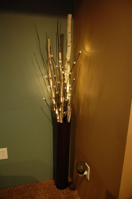 floor vase with birch, branches, and lighted branches