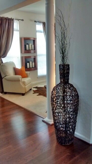 large wicker floor vase with branches