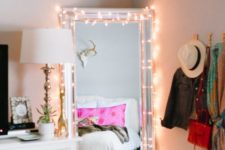 24 string lights on the mirror to help you get dressed