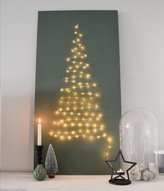 a Christmas wall art made of only lights is a pretty last-minute idea that you may go for