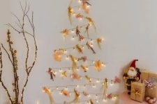 a catchy light wall-mounted holiday tree with colorful dried flowers and a star is amazing for Christmas