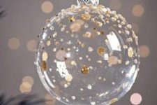 a clear glass ornament with gold and copper soft polka dots is a lovely idea for a glam and chic wedding