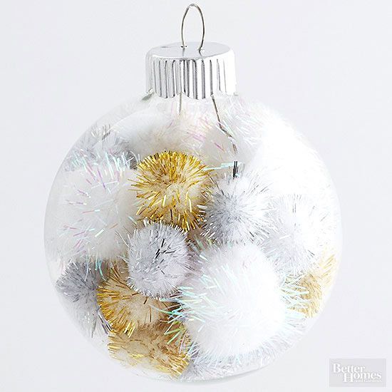 a clear holiday ornament fileld with gold and sivler tinsel fluffies looks very cool, fresh and bright