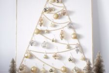 a glam wall art Christmas tree of beads, with elegant metallic ornaments, a star topper is lovely