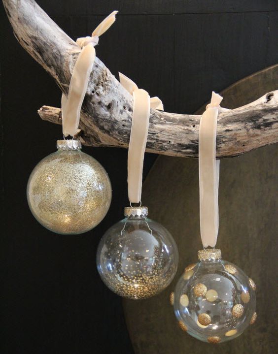 clear Christmas ornaments decorated with gold polka dots and gold glitter look very fun, bright and lovely