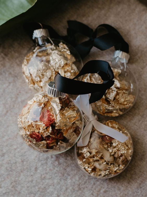 clear Christmas ornaments filled with dried flowers and gold foil are very nice and bright ones