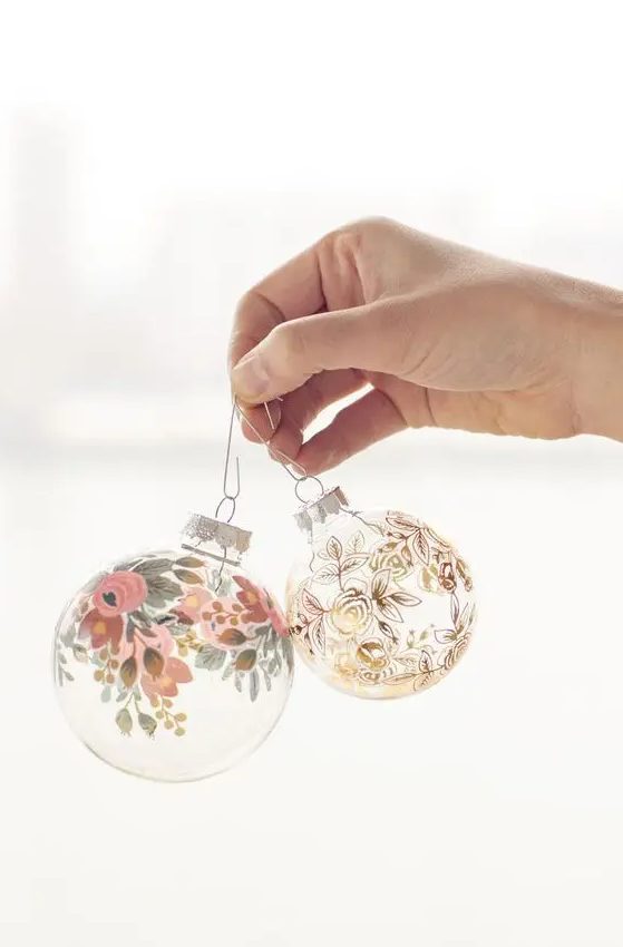 clear glass Christmas ornaments decorated with paints - floral patterns here and there