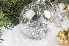 clear glass Christmas ornaments filled with stars are amazing for styling your Christmas tree