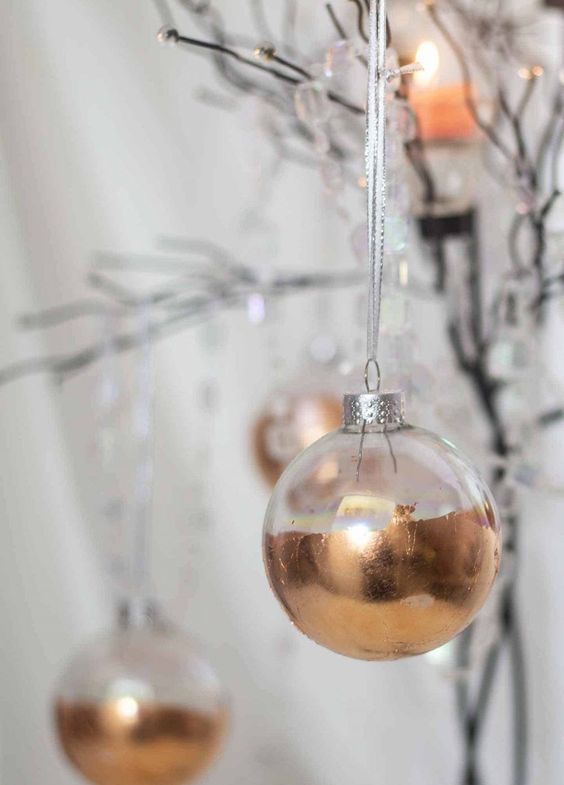 clear glass ornaments done with color blocking with copper paint are glam, chic and very up-to-date