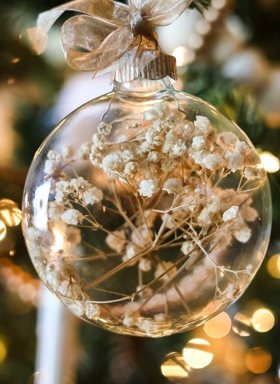 clear glass ornaments with baby's breath are a beautiful and ethereal Christmas decor idea