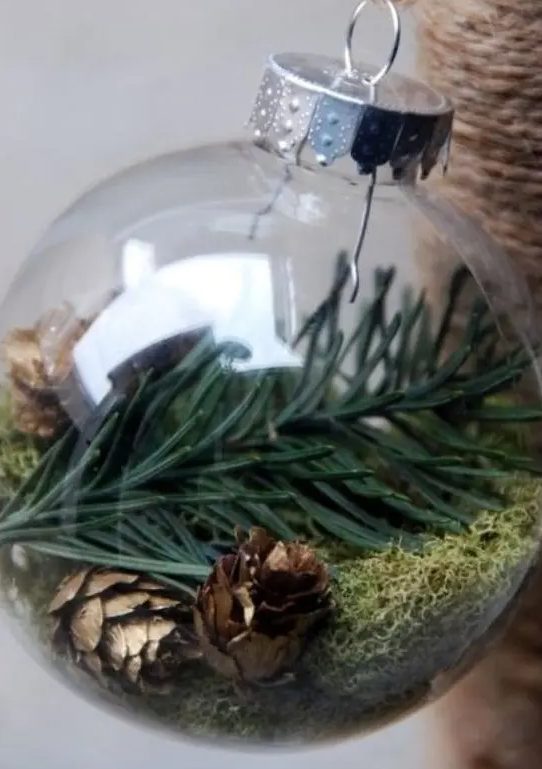 Evergreens, tiny pinecones and moss make a great nature inspired ornament for a rustic or woodland Christmas tree