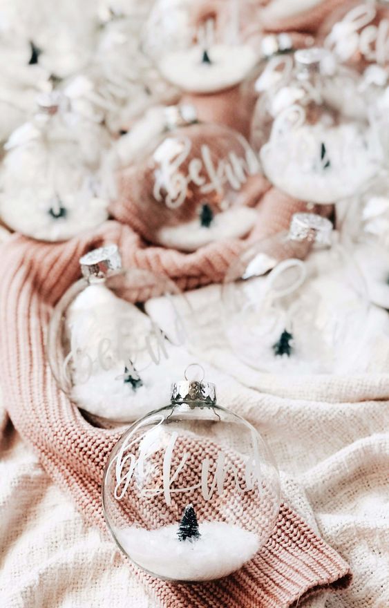 pretty clear ornaments with calligraphy and faux snow plus tiny trees inside will be amazing for tree decor