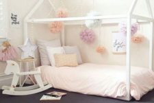 04 white frame house bed with pompoms hanging all over