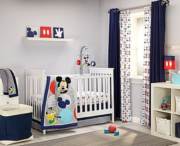 boy's nursery with red and navy touches and Mickey prints