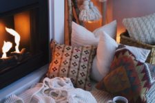 09 knit and crochet blankets and pillows for a cozy fireplace nook