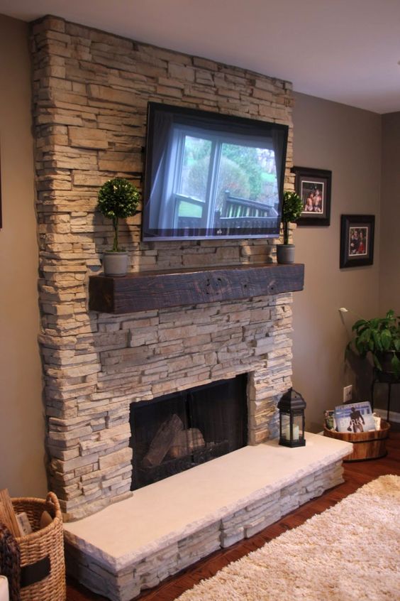 stone accent wall for a fireplace and a TV