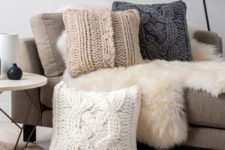 11 oversized cable knit pillows and faux fur for maximal comfort