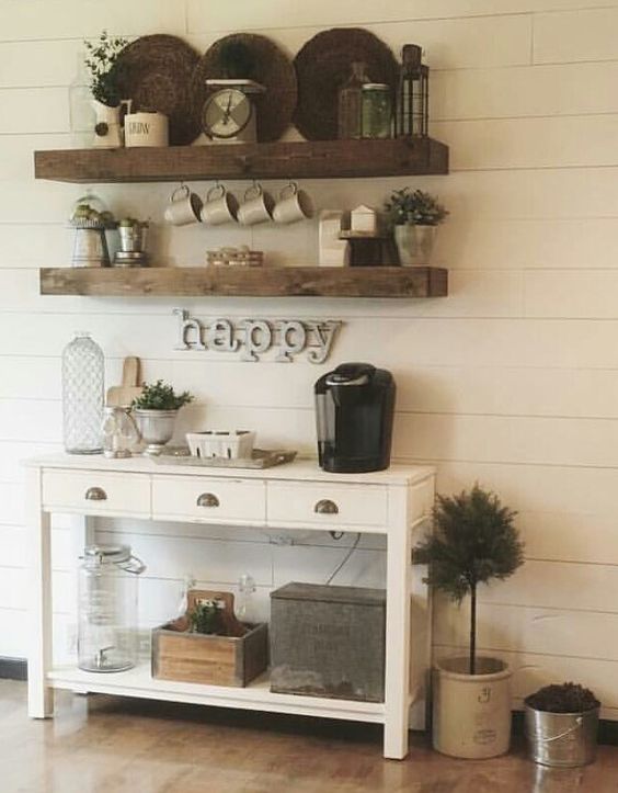 rustic coffee and tea station with open shelving and a simple console table