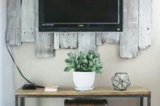 12 rustic weathered wood boards as a TV panel
