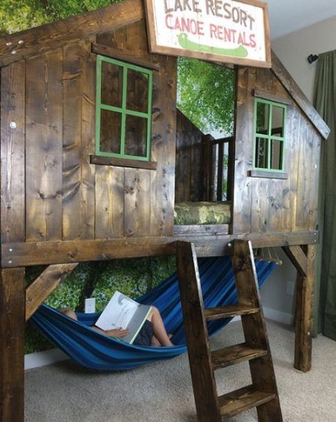 camping clubhouse loft bed for a kid with a hammock under it