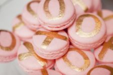 18 blush macarons with gold metallic XO letters