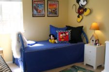 18 boy’s bedroom with blue and yellow shades and Mickey patterns here and there