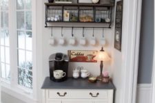 18 cozy vintage-inspired coffee station with a handmade console and wire baskets with various stuff