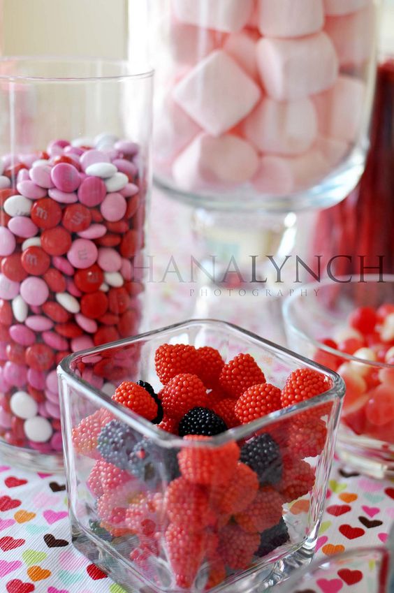 put red and pink foods and candy in various glass jars and vases as festive decorations you can eat