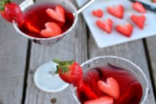 23 strawwberry cocktails topped with fresh berries