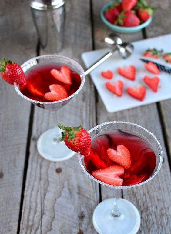 strawwberry cocktails topped with fresh berries