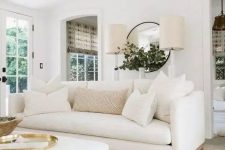 an airy living room with a white sofa
