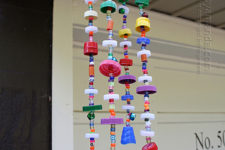 DIY recyled plastic lid wind chimes