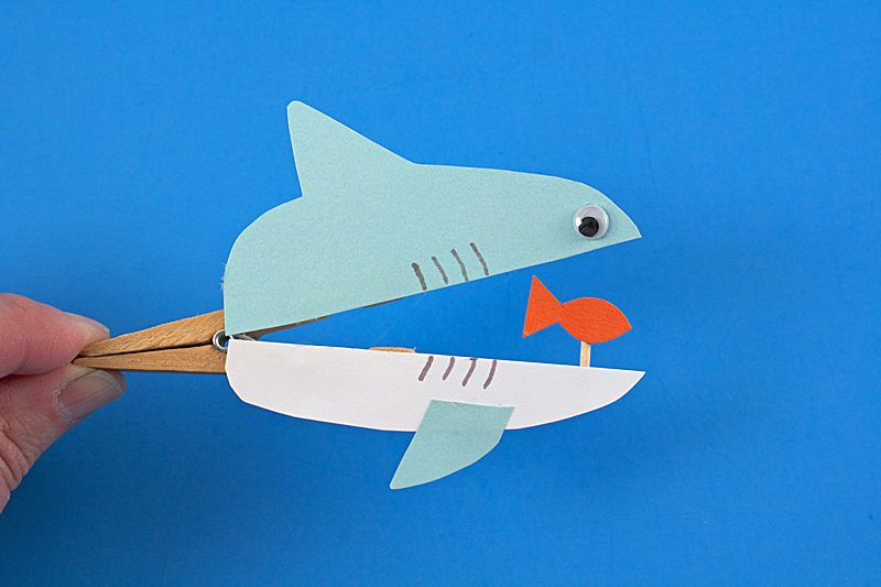 DIY clothespin shark with a fish (via www.kixcereal.com)