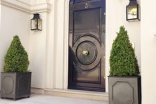 02 a black front door, black planters with boxwood for a chic look