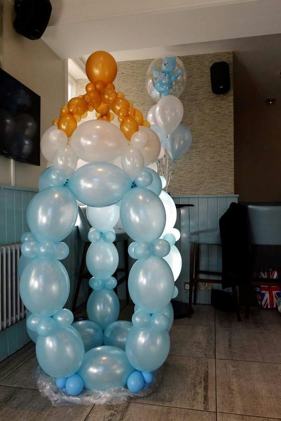 giant balloon pacifier in blue for a boy's baby shower