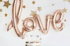 10 LOVE letter balloons as a dessert table backdrop