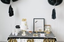 14 black balloons with tassels for an elegant black, white and gold dessert table