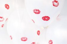 14 white balloons with red kisses