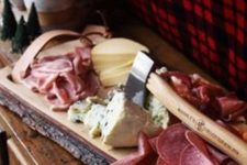 15 meat and cheese board piled high is a must for a lumberjack party