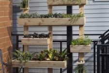 15 vertical garden system for a balcony made of wooden planks