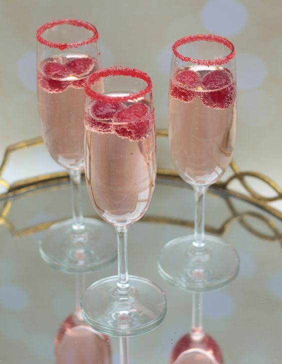 pink signature cocktails with raspberries