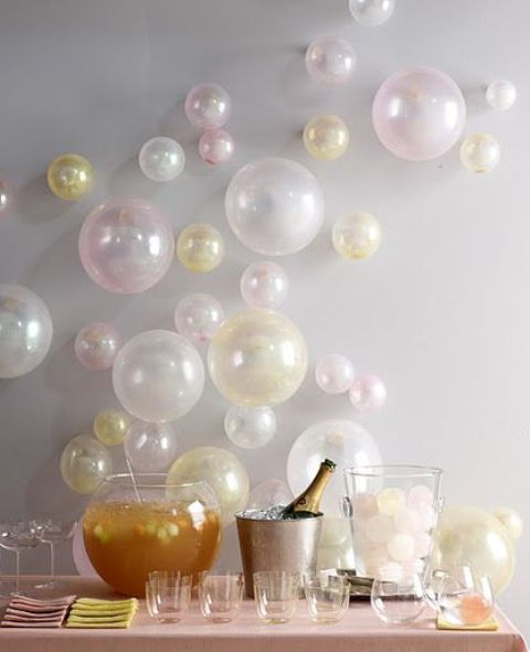 pastel balloons attached to the wall as a bacdrop for a drink station