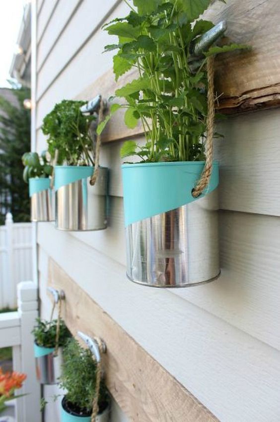 collect aluminum cans, add an interesting color graphic, and hang along an exterior wall or porch beam