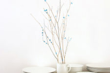 DIY blue yarn and paper covered branches for display