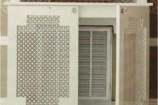 how to hide an ugly vent with a cool furniture piece with perforated doors