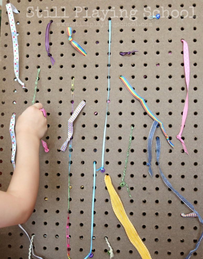 DIY ribbon pull board for kids' motor skills (via www.stillplayingschool.com)