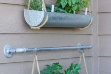 hanging garden on the wall using galvanizd planters from West Elm