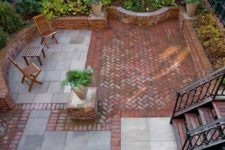 this awesome brick and stone patio makes incredible use of a small, enclosed yard space
